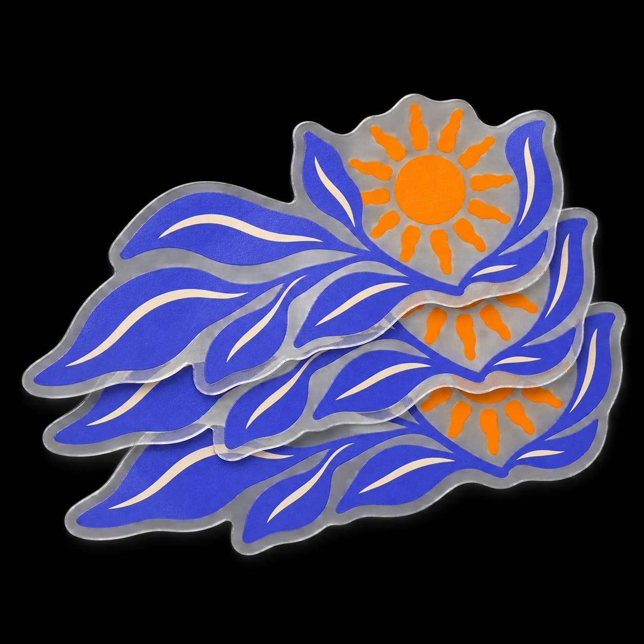 Stack of custom clear stickers with purple flowing shapes and an orange sun