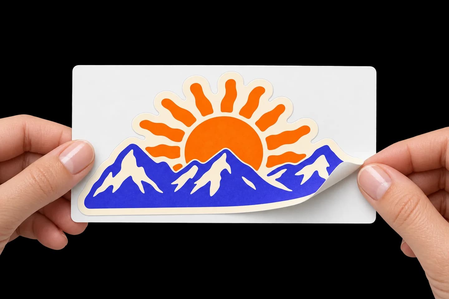 Illustration of a mountain-and-sun sticker peeling away from its larger, intact rectangular backing